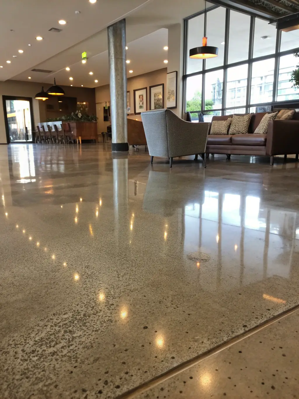 A brightly lit retail space featuring polished concrete flooring with a subtle, modern design, enhancing the store's aesthetic appeal and durability.